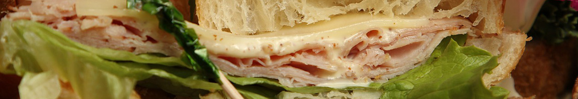 Eating Sandwich Colombian at Sandwich Qbano South Beach restaurant in Miami Beach, FL.